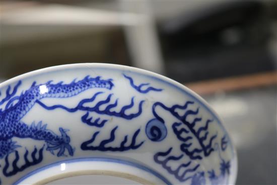 A Chinese blue and white dragon dish, diameter 16.3cm, some damage